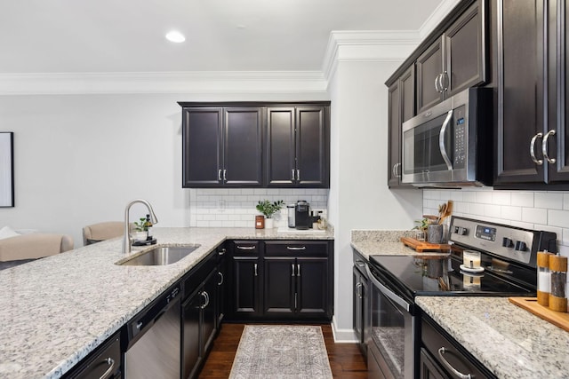 212 Walden Village Ln, Nashville, TN 37210 - kitchen with appliances with stainless steel finishes, a sink, ornamental molding, light stone countertops, and dark wood-style floors