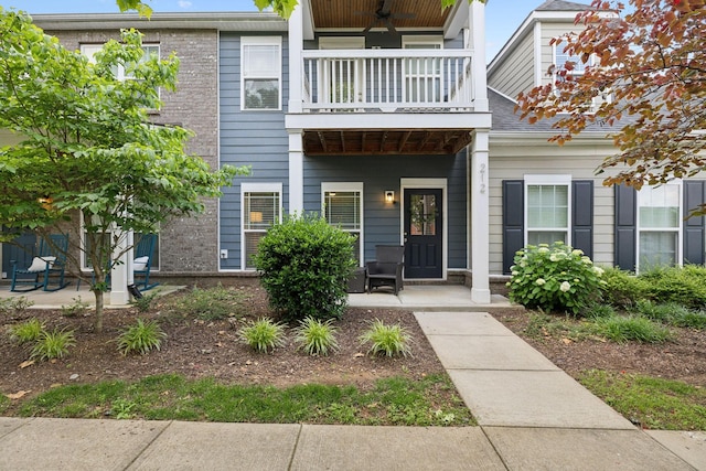 212 Walden Village Ln, Nashville, TN 37210 - entrance to property with a balcony, covered porch, brick siding, and a ceiling fan