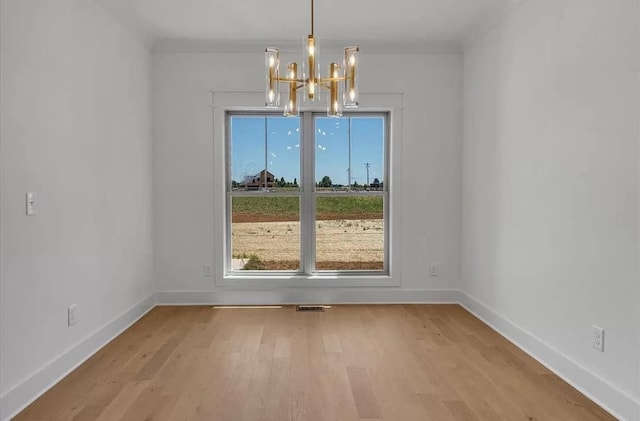691 Compton Rd, Murfreesboro, TN 37130 - unfurnished dining area featuring a chandelier, light wood-type flooring, and baseboards