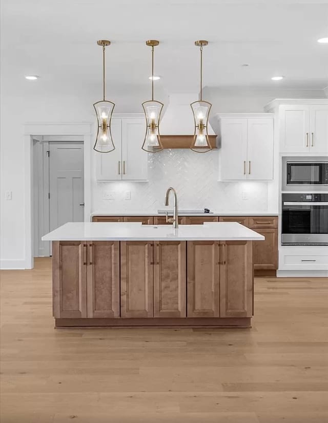 691 Compton Rd, Murfreesboro, TN 37130 - kitchen with appliances with stainless steel finishes, light countertops, decorative backsplash, light wood-type flooring, and recessed lighting