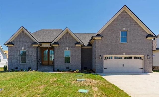 691 Compton Rd, Murfreesboro, TN 37130 - view of front of house with a front lawn, brick siding, a garage, and driveway