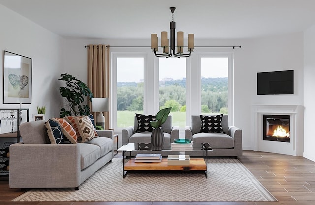 1006 Zane Dr, Mount Juliet, TN 37122 - living room featuring a chandelier, wood finished floors, and a glass covered fireplace