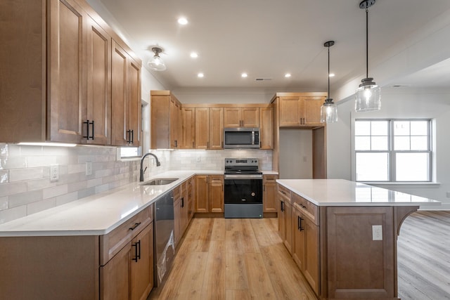 516 Willow Grv Ct, Ringgold, GA 30736 - kitchen with appliances with stainless steel finishes, a sink, light wood-style flooring, decorative backsplash, and light countertops