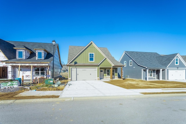 516 Willow Grv Ct, Ringgold, GA 30736 - craftsman house featuring concrete driveway, board and batten siding, a garage, and a porch