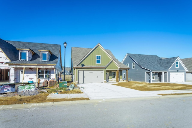 516 Willow Grv Ct, Ringgold, GA 30736 - view of front of house featuring board and batten siding, concrete driveway, and a garage