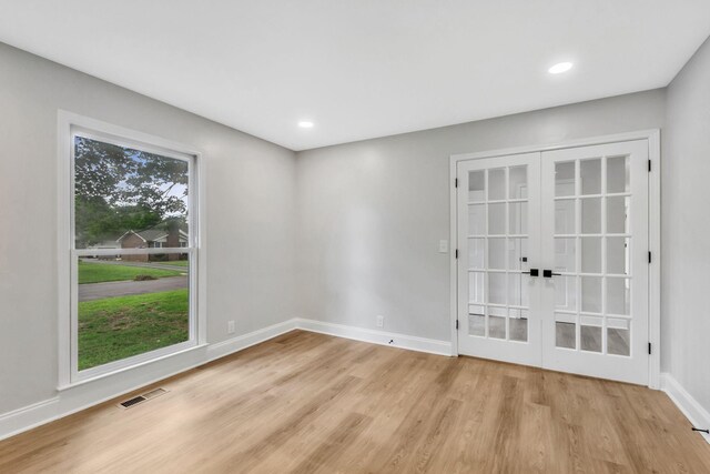 2302 Surrey Dr, Murfreesboro, TN 37129 - spare room featuring french doors, light wood finished floors, baseboards, and recessed lighting
