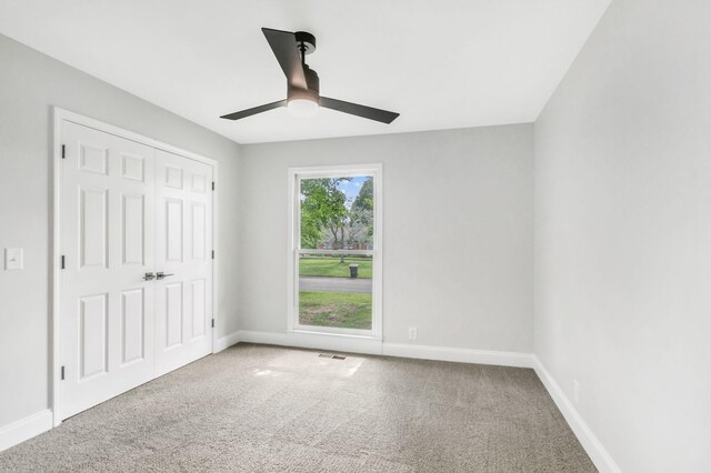 2302 Surrey Dr, Murfreesboro, TN 37129 - unfurnished bedroom featuring carpet floors, baseboards, a closet, and a ceiling fan