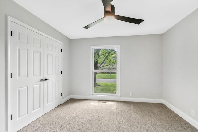 2302 Surrey Dr, Murfreesboro, TN 37129 - unfurnished bedroom with carpet flooring, baseboards, ceiling fan, and a closet