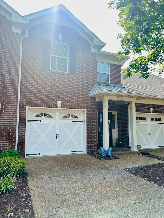 1816 Brentwood Pointe, Franklin, TN 37067 - view of front of home featuring brick siding, concrete driveway, and a garage