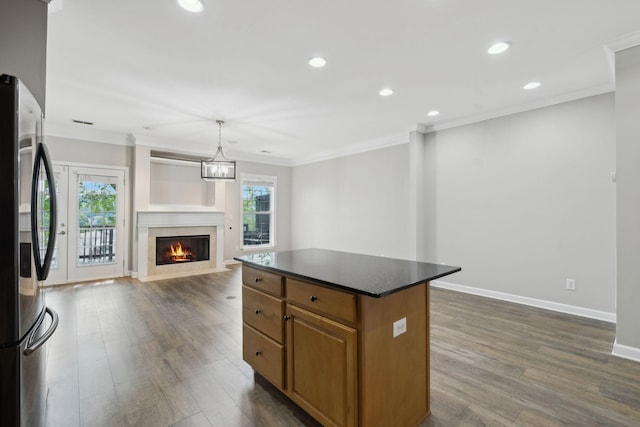 1816 Brentwood Pointe, Franklin, TN 37067 - kitchen with freestanding refrigerator, dark countertops, open floor plan, crown molding, and a kitchen island