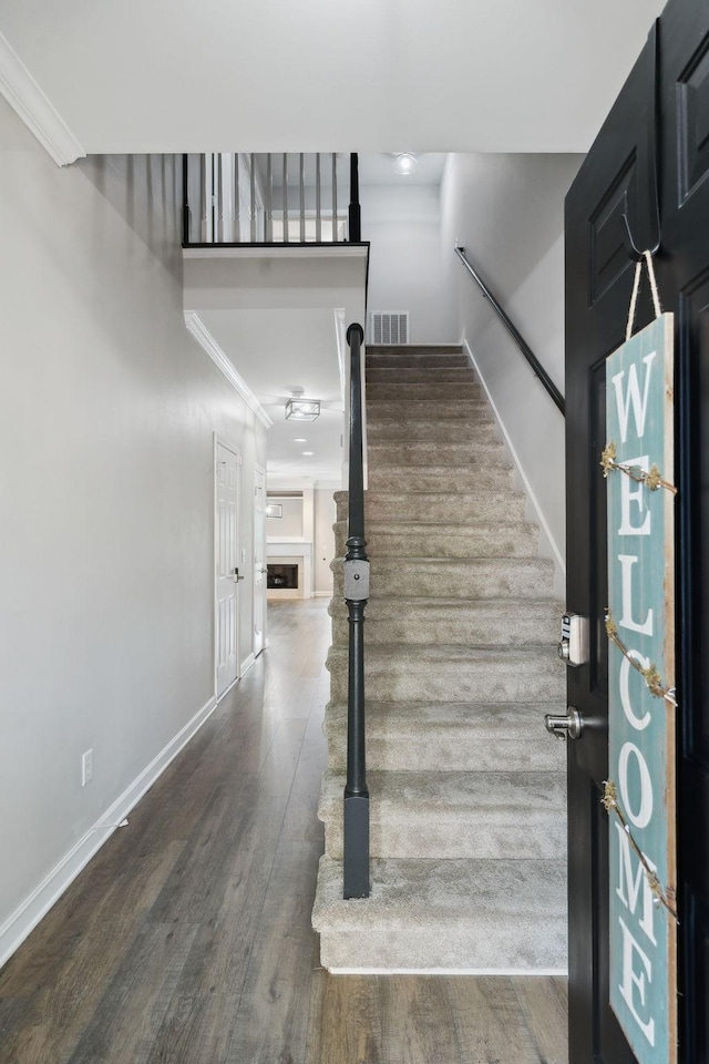 1816 Brentwood Pointe, Franklin, TN 37067 - foyer entrance featuring baseboards, wood finished floors, ornamental molding, and a fireplace