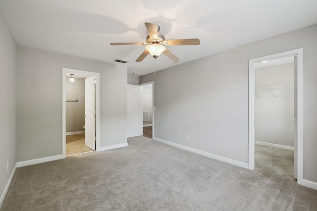 1816 Brentwood Pointe, Franklin, TN 37067 - unfurnished bedroom with a spacious closet, carpet, a closet, and baseboards