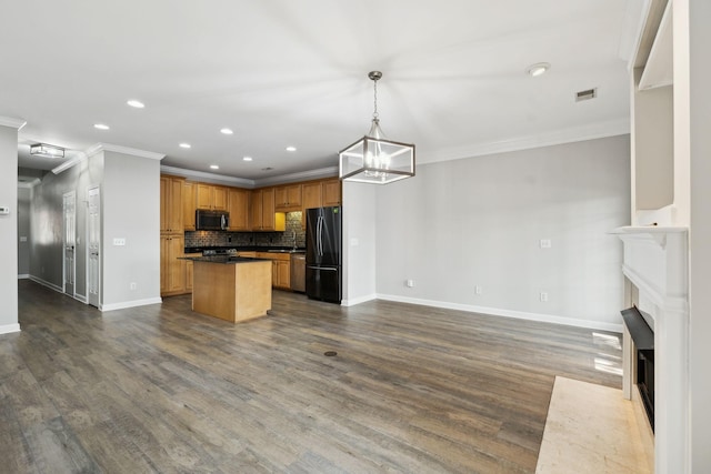 1816 Brentwood Pointe, Franklin, TN 37067 - kitchen featuring stainless steel appliances, baseboards, a fireplace with flush hearth, open floor plan, and recessed lighting