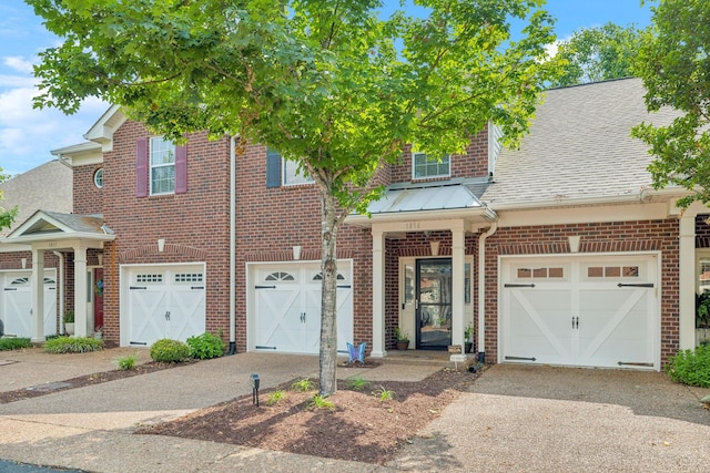 1816 Brentwood Pointe, Franklin, TN 37067 - view of front of property featuring driveway, brick siding, a garage, and roof with shingles