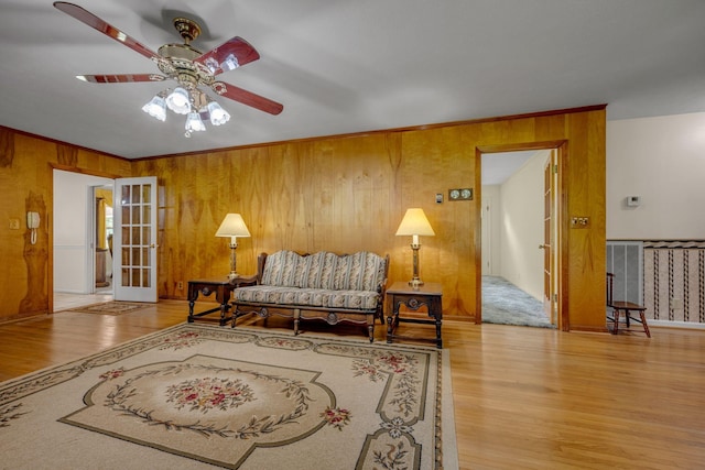 311 Broadview Dr, Dickson, TN 37055 - living area with a ceiling fan, wood finished floors, and wood walls