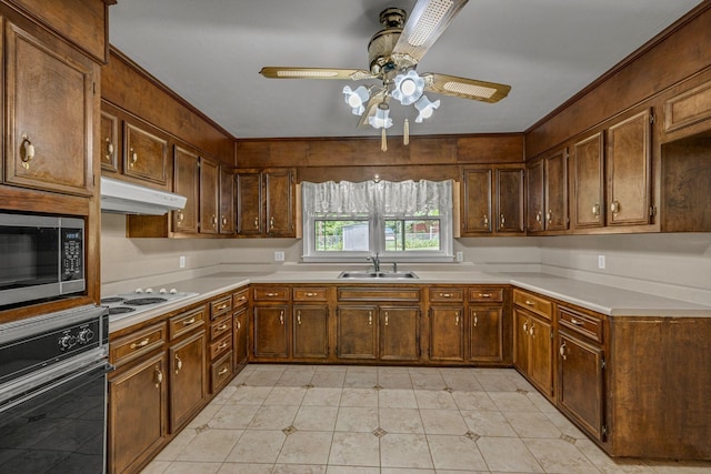 311 Broadview Dr, Dickson, TN 37055 - kitchen featuring oven, under cabinet range hood, a sink, stainless steel microwave, and a ceiling fan