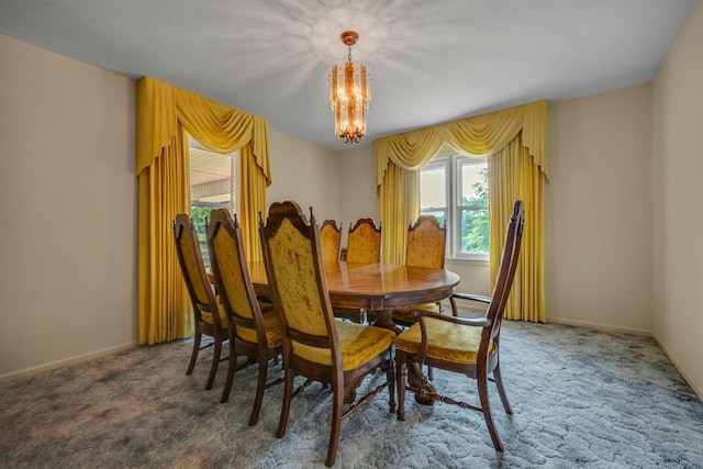 311 Broadview Dr, Dickson, TN 37055 - carpeted dining area with a chandelier and baseboards