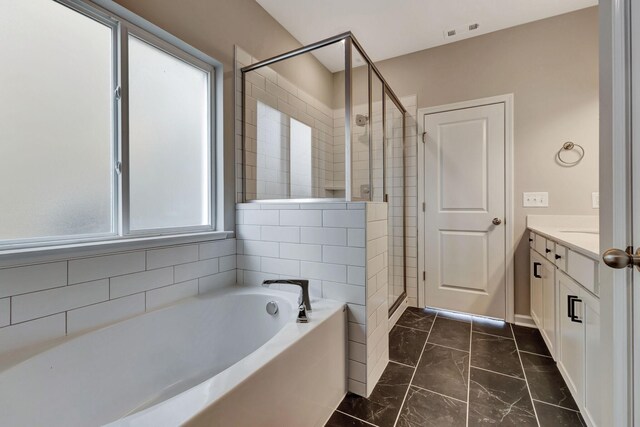 1012 Indigo Aly, Brentwood, TN 37027 - full bath featuring a garden tub, a stall shower, marble finish flooring, vanity, and baseboards