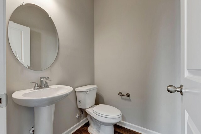 1012 Indigo Aly, Brentwood, TN 37027 - half bathroom featuring toilet, baseboards, and wood finished floors
