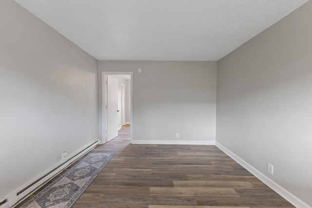 276 White Bridge Pike Unit 70, Nashville, TN 37209 - unfurnished room with baseboard heating, dark wood finished floors, and baseboards