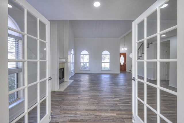 3117 Harborwood Dr, Nashville, TN 37214 - unfurnished living room with a premium fireplace, dark wood finished floors, baseboards, recessed lighting, and a towering ceiling