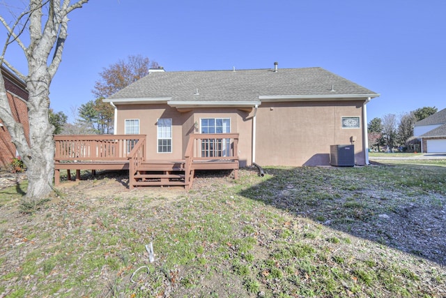 3117 Harborwood Dr, Nashville, TN 37214 - rear view of property featuring stucco siding, cooling unit, a chimney, a deck, and a lawn