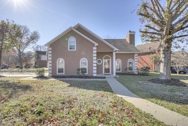 3117 Harborwood Dr, Nashville, TN 37214 - view of front of house featuring a chimney, stucco siding, and a front lawn