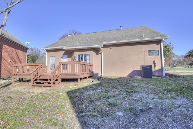 3117 Harborwood Dr, Nashville, TN 37214 - back of property with central AC, stucco siding, a chimney, and a deck
