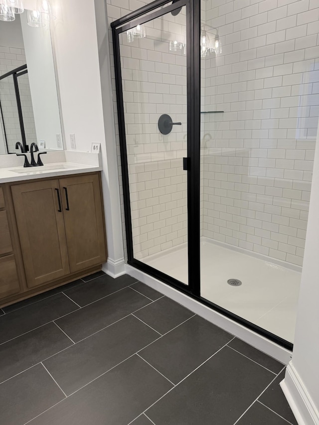1279 Linn Cove Ct, Gallatin, TN 37066 - full bath with a shower stall, vanity, tile patterned floors, and baseboards