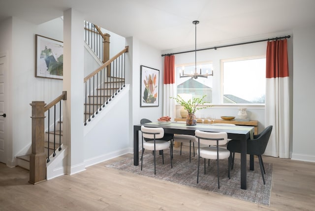 1102 Callaway Dr, Lebanon, TN 37087 - dining space with wood finished floors, stairway, a chandelier, and baseboards