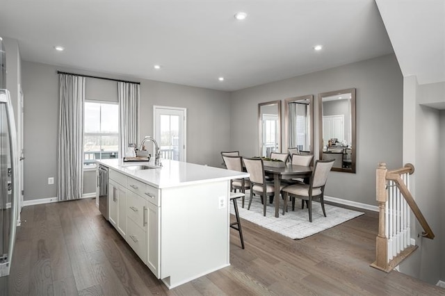 4038 Gaskill Dr Unit 113B, Smyrna, TN 37167 - kitchen with a sink, a center island with sink, white cabinetry, dark wood finished floors, and dishwasher