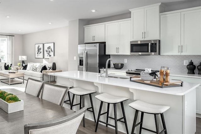 4038 Gaskill Dr Unit 113B, Smyrna, TN 37167 - kitchen with stainless steel appliances, a sink, tasteful backsplash, light countertops, and recessed lighting