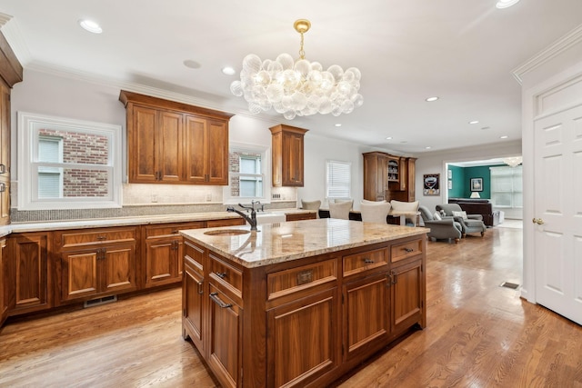 327 Whitworth Way, Nashville, TN 37205 - kitchen with a sink, a chandelier, ornamental molding, brown cabinets, and recessed lighting
