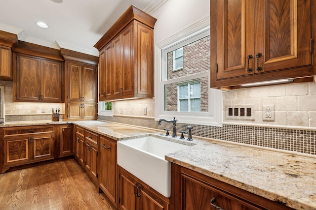 327 Whitworth Way, Nashville, TN 37205 - kitchen featuring tasteful backsplash, a sink, light stone counters, healthy amount of natural light, and crown molding