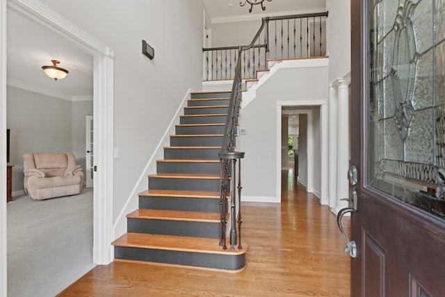 1010 Saint Blaise Trl, Gallatin, TN 37066 - entryway featuring stairway, crown molding, baseboards, wood finished floors, and a towering ceiling