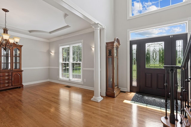 1010 Saint Blaise Trl, Gallatin, TN 37066 - foyer entrance with wood finished floors, a chandelier, ornate columns, baseboards, and ornamental molding