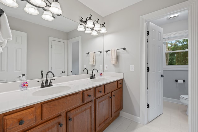 1010 Saint Blaise Trl, Gallatin, TN 37066 - bathroom with double vanity, tile patterned floors, toilet, and baseboards
