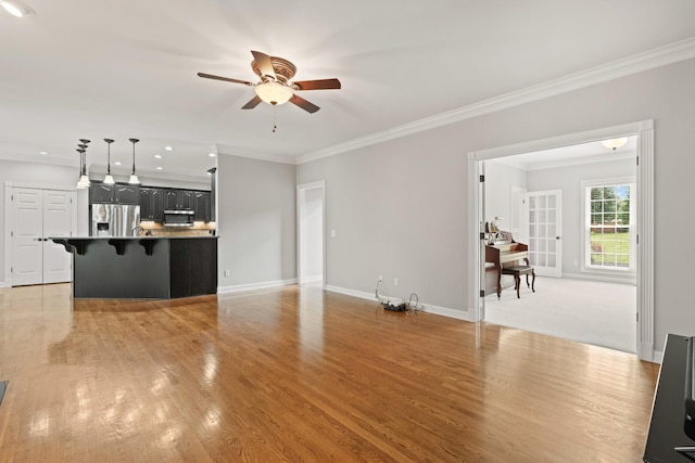 1010 Saint Blaise Trl, Gallatin, TN 37066 - unfurnished living room with ceiling fan, ornamental molding, light wood-style floors, baseboards, and recessed lighting