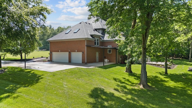 1010 Saint Blaise Trl, Gallatin, TN 37066 - view of side of property with brick siding, an attached garage, a lawn, and driveway