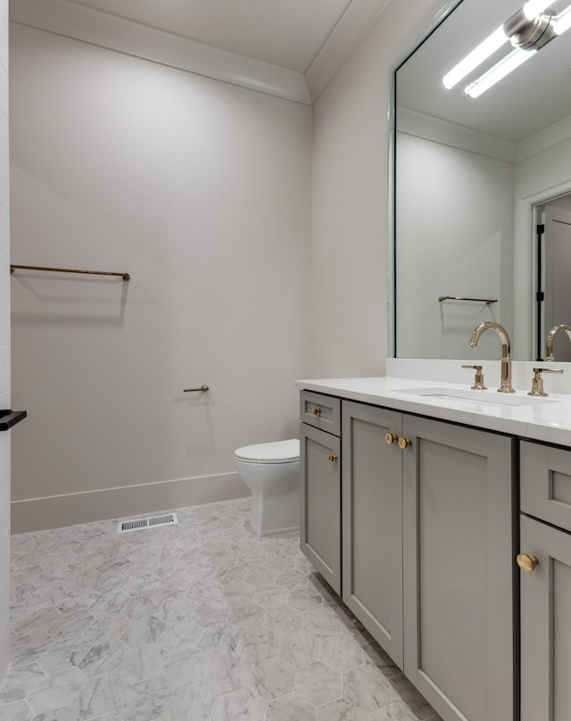 2756 Otterham Dr, Thompsons Station, TN 37179 - bathroom featuring vanity, toilet, marble finish floors, and crown molding