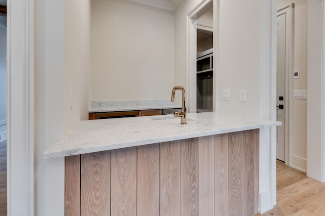 2756 Otterham Dr, Thompsons Station, TN 37179 - bar area featuring light wood finished floors and a sink