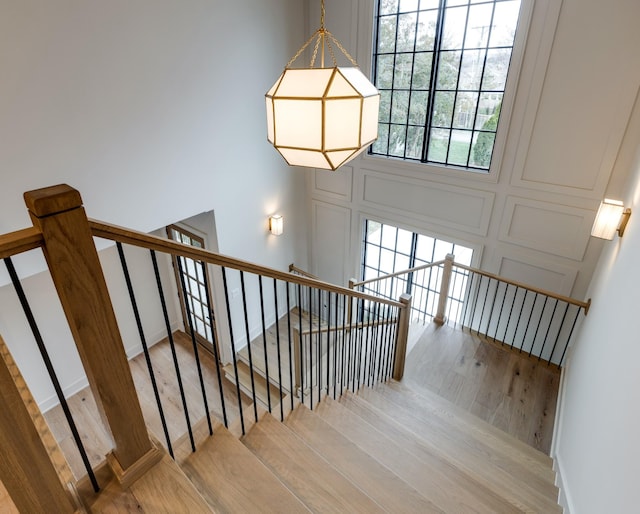 2756 Otterham Dr, Thompsons Station, TN 37179 - stairs with wood finished floors and baseboards