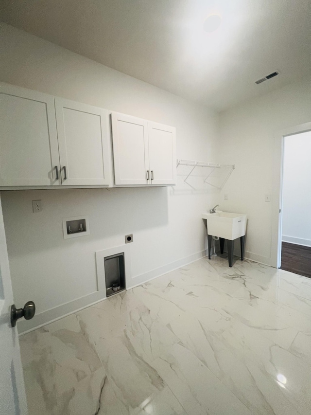 310 Carver Ln, Lebanon, TN 37087 - laundry room featuring cabinet space, hookup for an electric dryer, marble finish floors, and washer hookup