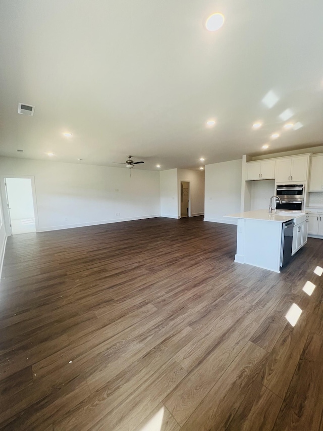 310 Carver Ln, Lebanon, TN 37087 - unfurnished living room with dark wood-style flooring, ceiling fan, and recessed lighting