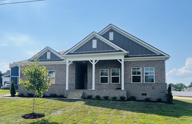 310 Carver Ln, Lebanon, TN 37087 - craftsman-style house with board and batten siding, a front yard, and brick siding