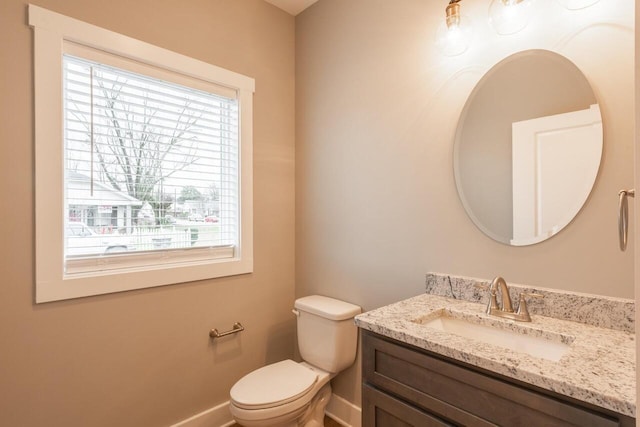 1600 Anderson Ave, Chattanooga, TN 37404 - bathroom with healthy amount of natural light, vanity, toilet, and baseboards