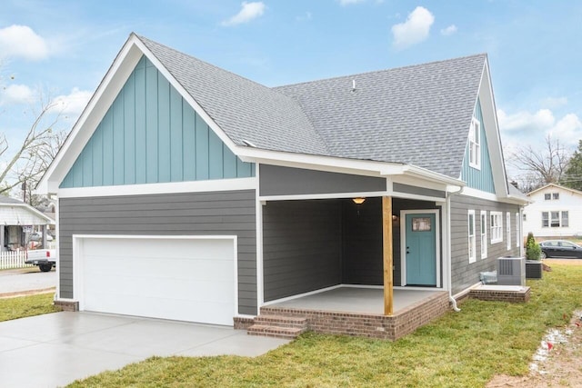 1600 Anderson Ave, Chattanooga, TN 37404 - view of front facade featuring board and batten siding, a shingled roof, covered porch, and central AC unit