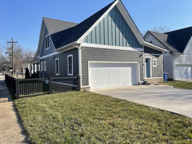 1600 Anderson Ave, Chattanooga, TN 37404 - view of front facade featuring board and batten siding, concrete driveway, a garage, and roof with shingles