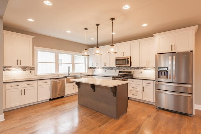 1600 Anderson Ave, Chattanooga, TN 37404 - kitchen featuring stainless steel appliances, a sink, tasteful backsplash, white cabinetry, and recessed lighting