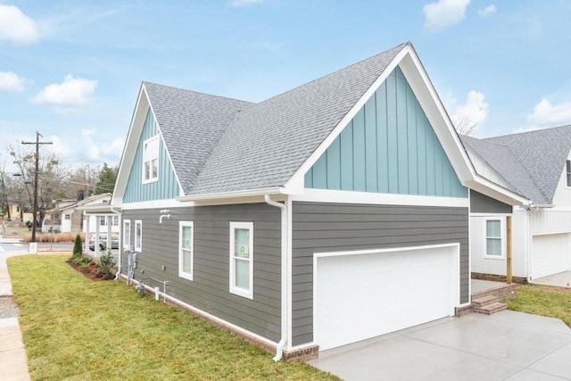 1600 Anderson Ave, Chattanooga, TN 37404 - view of home's exterior with a shingled roof, board and batten siding, driveway, and a lawn
